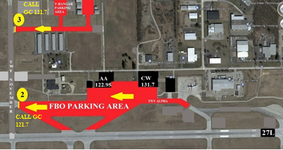 A satellite photo of the east corner of the South Bend International Airport airfield including east runway 27 left, taxiway Alpha, taxiway November, and taxi-lane Tango. If the ATIS is advising runways 9 right, 18, or 30, this photo shows highlighted in red the FBO parking and t-hangar parking areas with the direction to proceed.