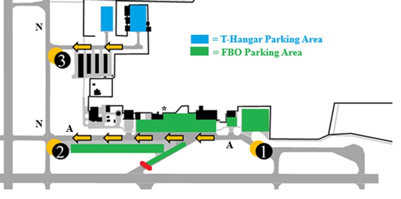 A created map of the east corner of the South Bend International Airport airfield including east runway 27 left, taxiway Alpha, taxiway November, and taxi-lane Tango. If the ATIS is advising runways 9 right or 18, this photo shows highlighted in green the FBO parking and highlighted in blue t-hangar parking areas with the direction to proceed.
