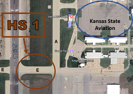 sln-hs1.png HS 1 TWY E crossing RWY 17/35 is active with student pilot midfield departures. Note the elevated RWY guard lights located on the east side of RWY 17/35 at TWY E.