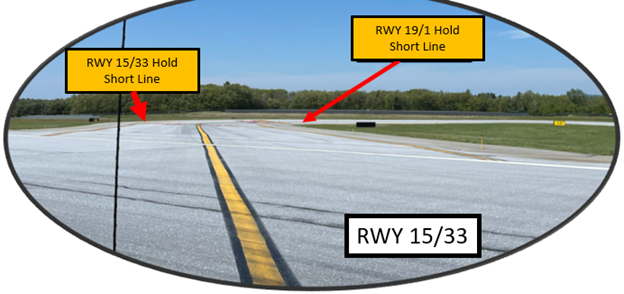 View approaching Hot Spot 1 while crossing RWY 15/33 on TWY A.  Notice that the RWY 19/1 Hold Short Line is barely visible at this point.