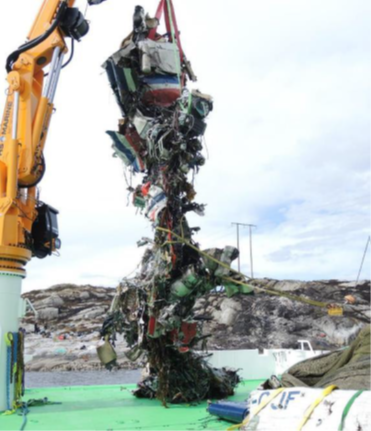 Photo of LN-OFJ main wreckage during recovery with tail boom seen in lower right corner.