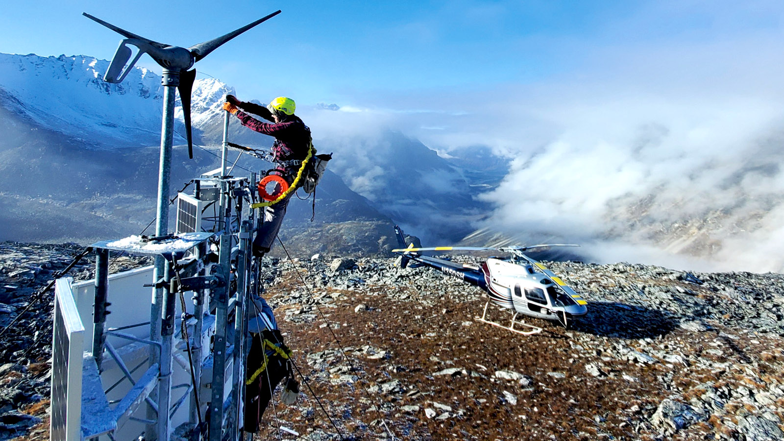 A technician maintains a remote mountaintop weather camera site in Alaska. This is one of 299 FAA weather cameras across the United States that help pilots be aware of conditions in near-real time so they can fly more safely. (Photo: FAA)