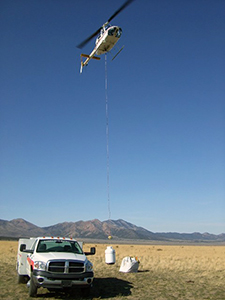 illustration of helicopter lifting up an object