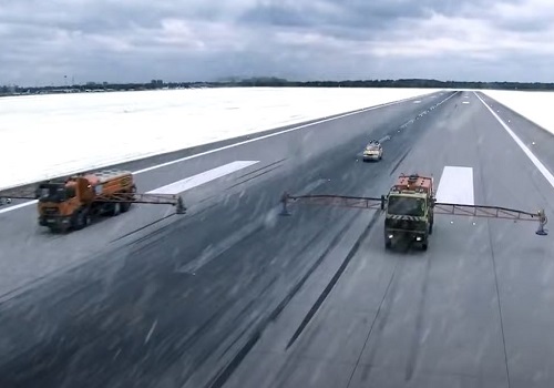 snow equipment on airport runway