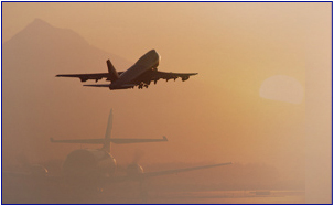 Aircraft taking off from runway in hazy conditions