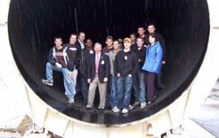 Students standing near engine