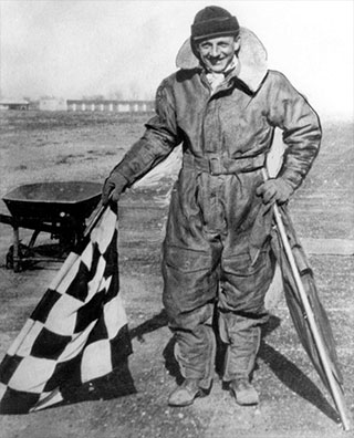 Archie W. League, air traffic controller with flags