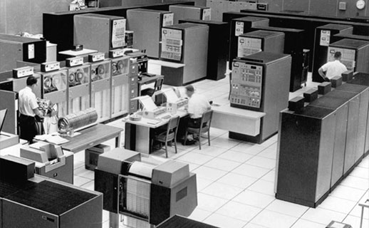 FAA center in Jacksonville using multiple IBM mainframes. Three Model 65s are along the left wall, while three Model 50s are towards the back. The control panel in front of the Model 50s panel is not a computer but a system monitoring panel.