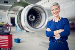 Woman standing in front of an aircraft
