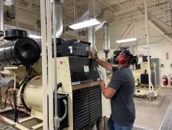 Technician working on a power system
