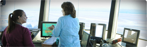 Two women working together at an air traffic control tower