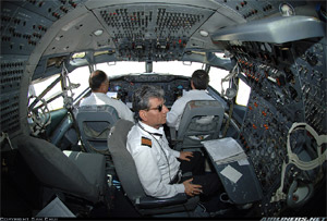 "Photo of 707 cockpit with pilots and flight engineer Photo copyright Sam Chui - used with permission"