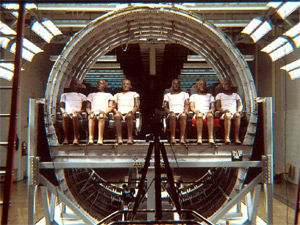 "Pretest setup photo of a transport aircraft fuselage section with several rows of seats at Transportation Research Center of Ohio"