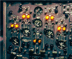 "Flight engineer's fuel system panel – fuel tank gauges are 5 round dials in an inverted "V" arrangement below the light pairs. Photo copyright AirNikon Collection - PIMA Air & Space Museum - used with permission"