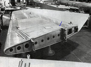 "Photo of right hand stabilizer in jig, showing clevis attachments at the front and rear spars Photo taken from accident report"