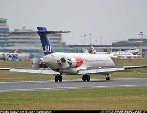 "MD-80 during landing showing deployed spoilers and thrust reversers Photo copyright John Farrington - used with permission"