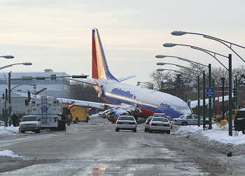 "Photo of Southwest Airlines Flight 1288, a Boeing 737-700, landing overrun at Chicago Midway Airport on December 8, 2005"