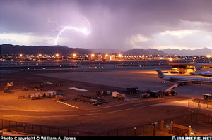 "Thunderstorm activity near Sky Harbor Airport, Phoenix, Arizona Photo copyright William A. Jones - used with permission"