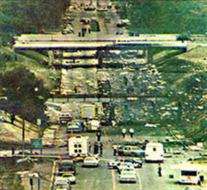 "NTSB photo looking north to impact site from a location on Middlebelt Road near the car rental building."