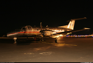 "Photo of an Embraer EMB-120 parked at night Photo Copyright Kyle Donagher - used with permission"