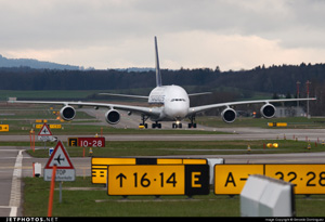 "Photo of airport signage. Many different signs are needed to accomplish airport navigation (Airbus A380 pictured). This photo shows directions to runway 16 and 14 via taxiway E at this airport. Photo copyright Gerardo Dominguez - used with permission"