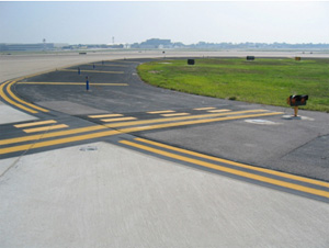 "Photo of extended runway holding position markings"