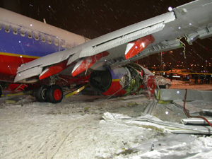 "Photo of Accident Scene Shortly After Runway Overrun - NTSB Docket Photo"
