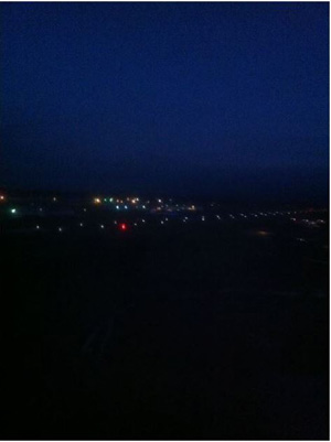 "Photo of dark nighttime conditions that existed at departure airport. Photo taken by one of the passengers"