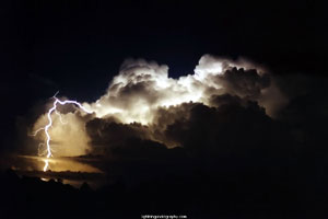 "Photo of cloud to ground lightning strike from a cumulonimbus cloud Photo copyright Michael Bath - used with permission"