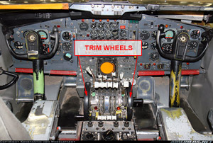 "Photo of boeing 720 Flight Deck Showing Trim Wheels on either Side of Center Console Photo copyright Konstantin Von Wedelstaedt – used with permission"
