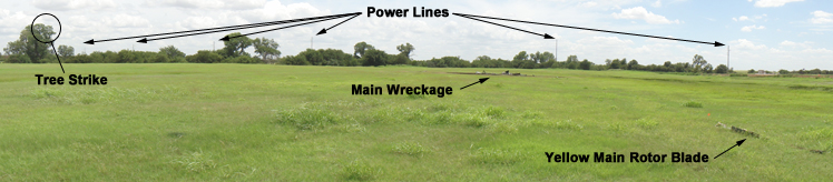 "Photo depicts locations of tree strike, power line poles, yellow main rotor blade, and main wreckage Photo - NTSB"