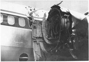 "Photo of damage to No. 1 engine and left fuselage - NTSB Docket Photo"