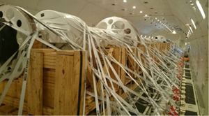 Photo of an example of special cargo load restrained to the cargo deck floor with tie-down straps