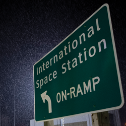 roadway sign that reads "international space station on ramp"