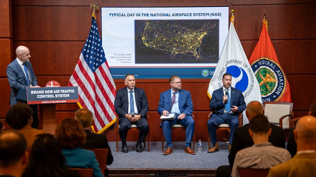 The FAA’s Thomas Draffen (at podium) is joined by fellow aviation representatives on a panel focused on improving air traffic telecommunications. (Photo: DOT)