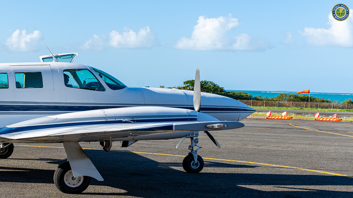 Charter flight at airport with water in background