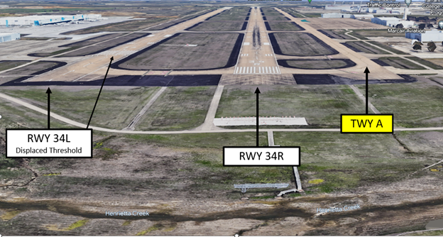 Wrong Surface Landing Risk exists at AFW. Photo of AFW 34L displaced threshold and RWY 34R and TWY A.