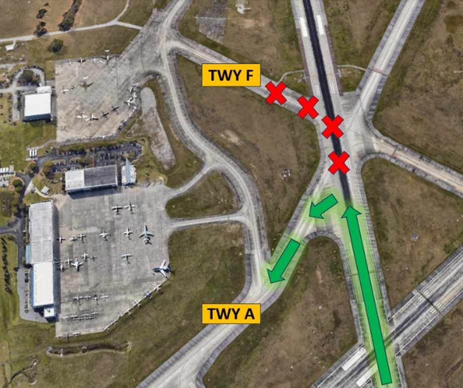 Image show Hot Spot 1 at CHS. 	General Aviation aircraft landing RWY 15 at night have difficulty with identifying and making the left turn onto TWY A to exit the RWY. Pilots often miss the turn to TWY A and turn onto TWY F.