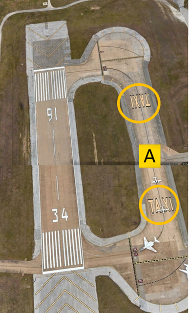 Picture of modified taxiway alpha depicting surface painted “Taxi” markings.