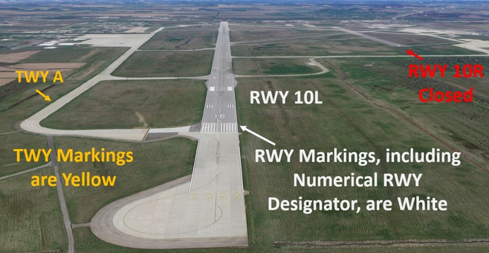 Picture oPicture of Runway One Zero Left and how Taxiway Alpha runs parallel to it. Highlighting that Taxiway markings are Yellow and Runway Markings are White. f Runway One Zero Left and how Taxiway Alpha runs parallel to it. Highlighting that Taxiway markings are Yellow and Runway Markings are White.