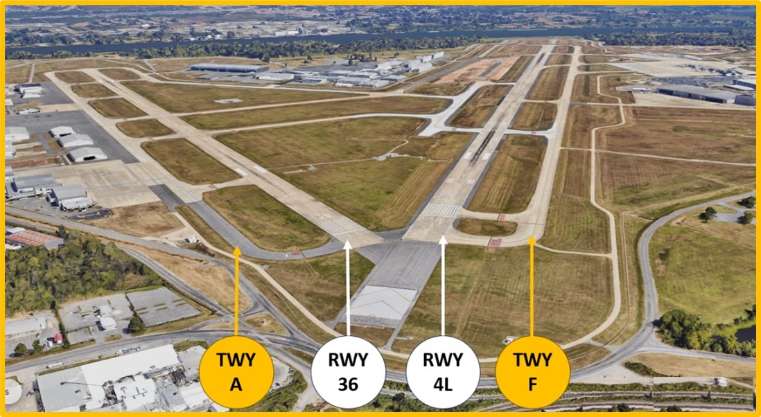Aerial view showing the proximity of the runway three six and runway four left thresholds along with the parallel taxiways.