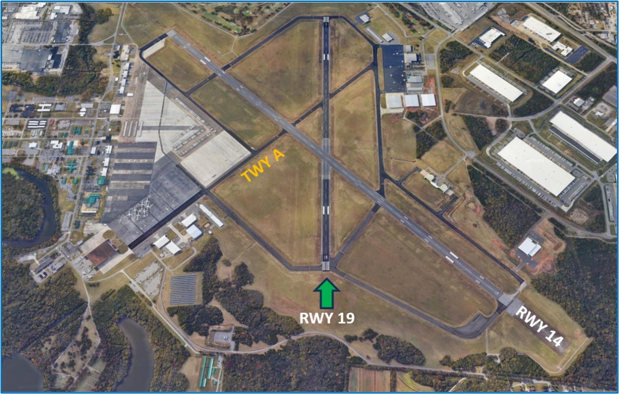 Overhead picture of the airport showing relationship of Runway One-Niner with Runway One-Four and Taxiway Alpha.