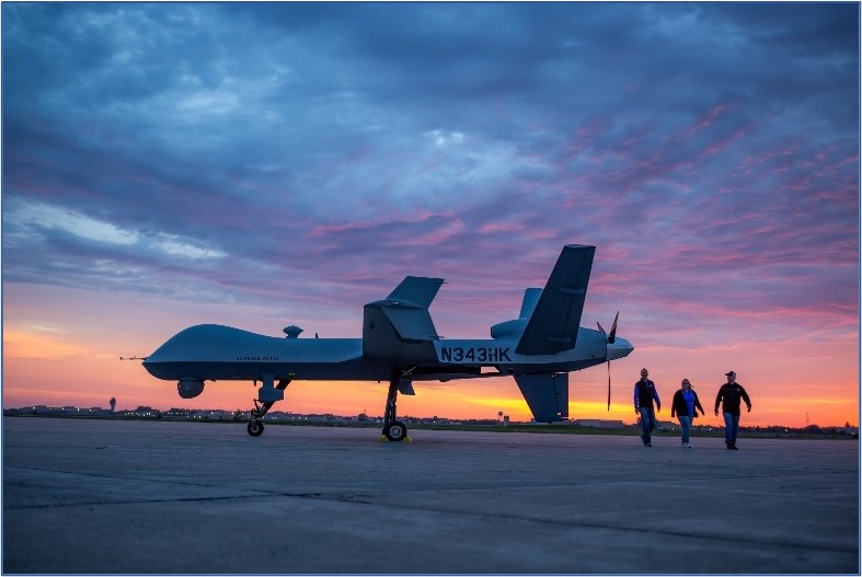 drone in foreground with sun setting behind it