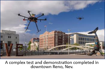 two drones flying near an urban scene 