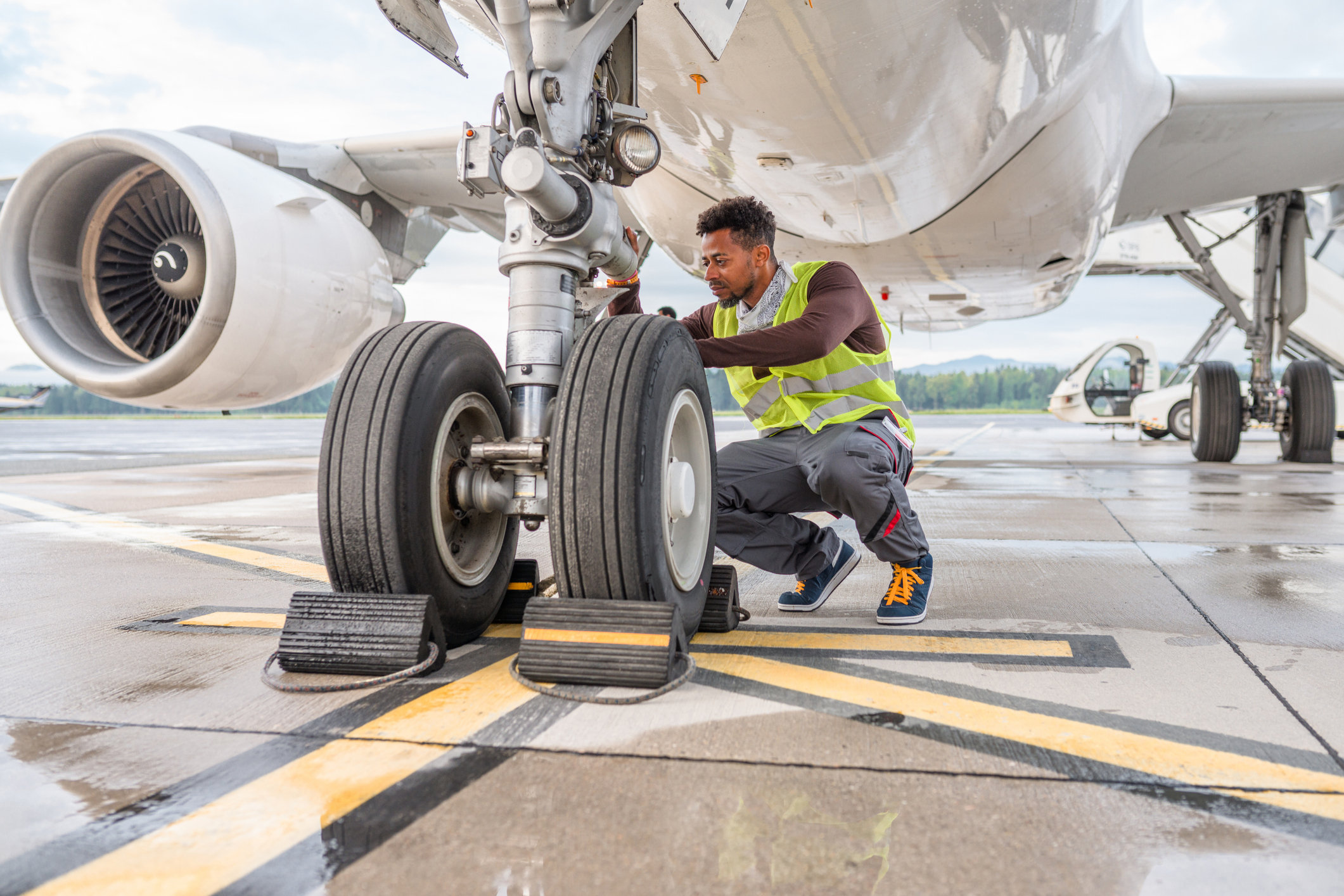man working on plane wheel