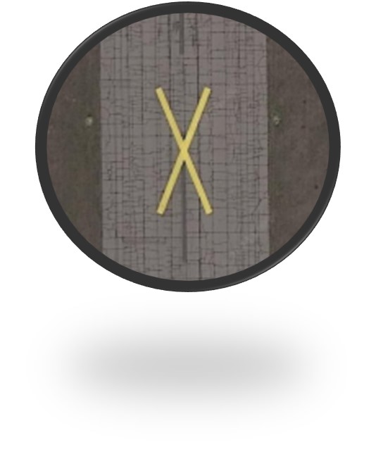 Close up of X marking on runway.