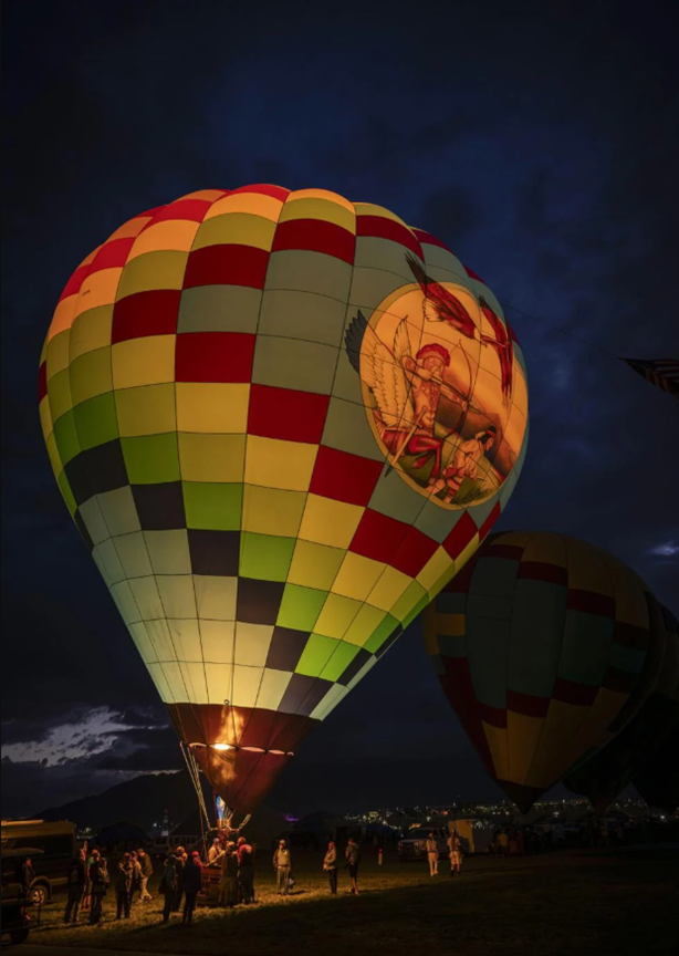 Pilot Mark Meyer ignites flame in his balloon “The Horizon” at Albuquerque Balloon Fiesta. (Photo: Chancey Bush, Albuquerque Journal)