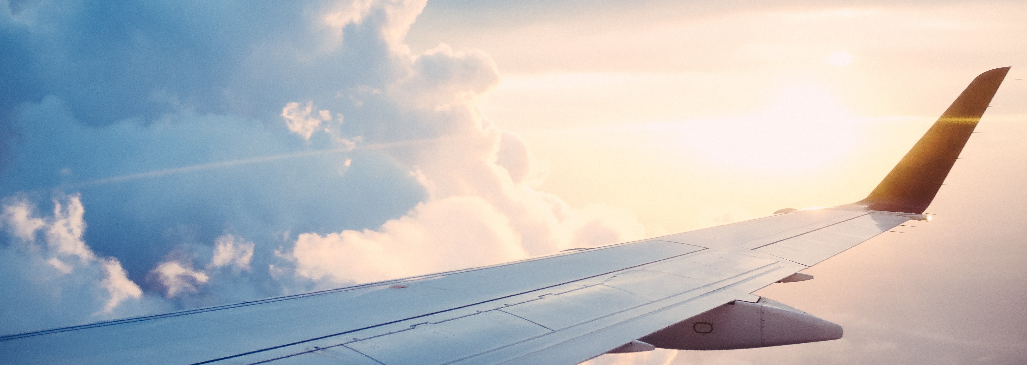airplane wing in the clouds