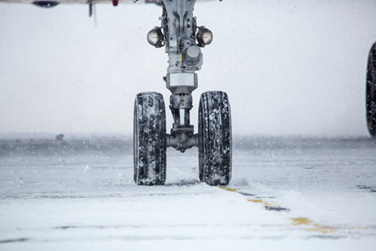 Landing gear in snow on runway