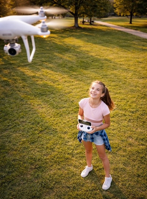 girl flying a drone for fun